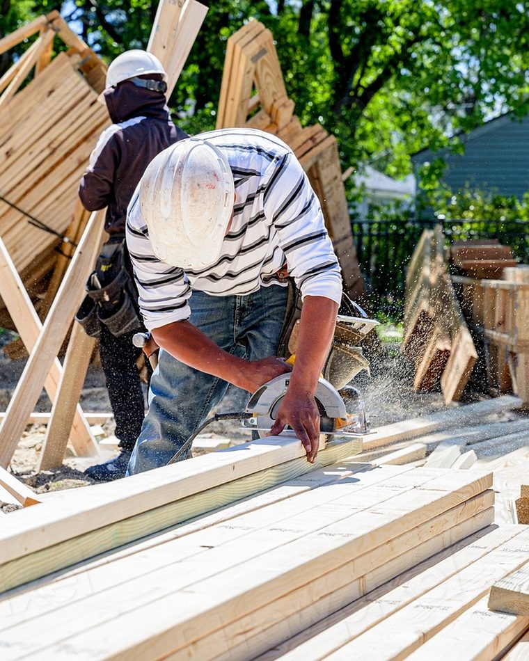 Carpenters framing a house on a CRF Properties renovation